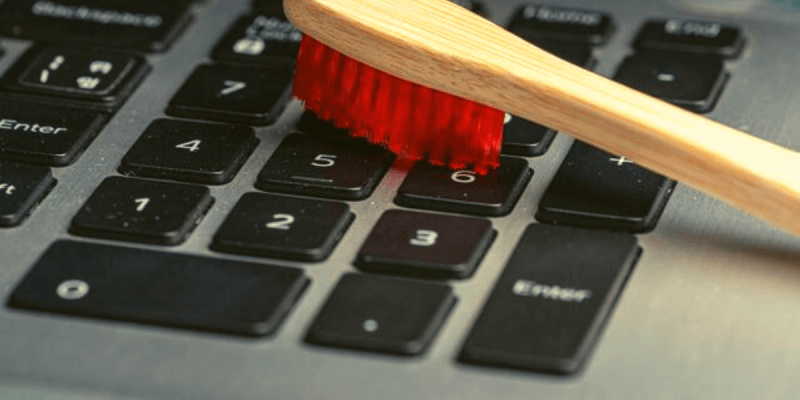 How to Clean Your Sticky Laptop Keyboard with A Toothbrush